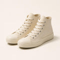 Cream canvas high-top sneakers with rubber toe cap