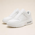 All-white leather low-top sneakers with cushioned sole